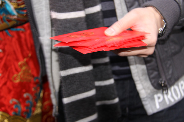Red envelopes of "lucky money" being distributed