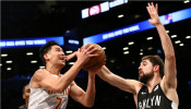 Brooklyn Nets forward Joe Harris (12) defends against Atlanta Hawks guard Jeremy Lin (7) 