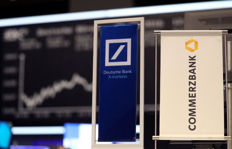 Banners of Deutsche Bank and Commerzbank are pictured in front of the German DAX in Frankfurt