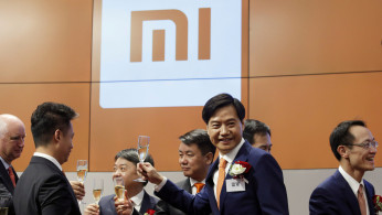 FILE PHOTO: Xiaomi founder Lei Jun attends listing of the company at Hong Kong Exchanges in Hong Kong