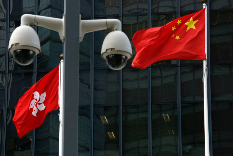 Chinese national flag and Hong Kong flag fly outside government headquarters
