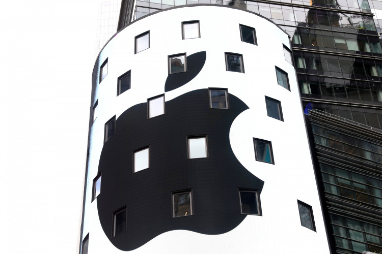 An electronic screen displays the Apple Inc. logo on the exterior of the Nasdaq Market Site following the close of the day's trading session in New York City