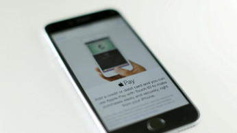An Apple iPhone 6 with Apple Pay is shown in this photo illustration