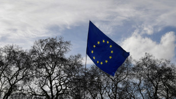 An EU flag is seen flying near the Houses of Parliament in London, Britain