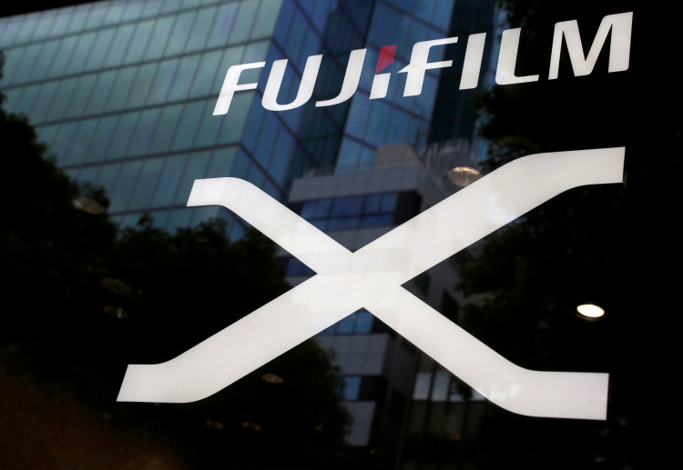 Fujifilm's company logo (top) is seen at its exhibition hall nearby the headquarters of Fujifilm Holdings Corp in Tokyo, Japan.