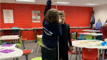student's measuring the height