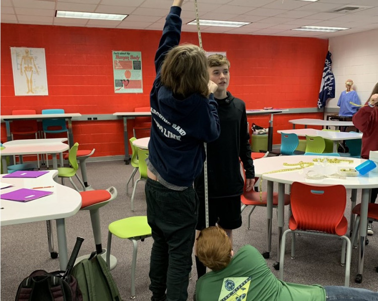 student's measuring the height
