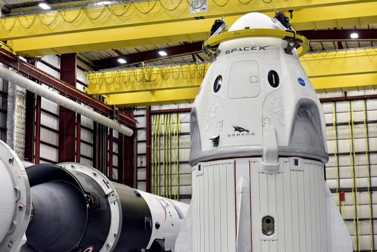 The Dragon crew capsule sits in the SpaceX hangar at Launch Complex 39-A, where the space ship and Falcon 9 booster rocket are being prepared for a January 2019 launch at Cape Canaveral