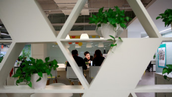 Employees work at the headquarters of Alibaba's Ant Financial Services Group in Hangzhou