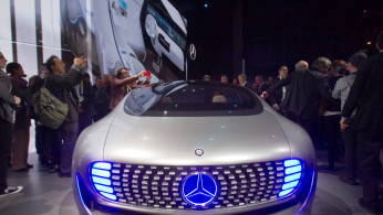 Journalist surround the Mercedes-Benz F015 Luxury in Motion autonomous concept car after it was unveiled during the 2015 International Consumer Electronics Show in Las Vegas