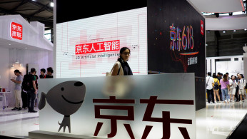 A sign of China's e-commerce company JD.com is seen at CES (Consumer Electronics Show) Asia 2018