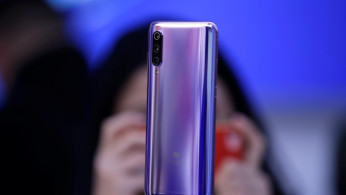 A new flagship phone Xiaomi Mi 9 is displayed after its launch ceremony in Beijing