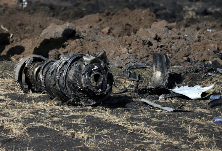 Engine parts are seen at the scene of the Ethiopian Airlines Flight ET 302 plane crash, near the town of Bishoftu, southeast of Addis Ababa, Ethiopia