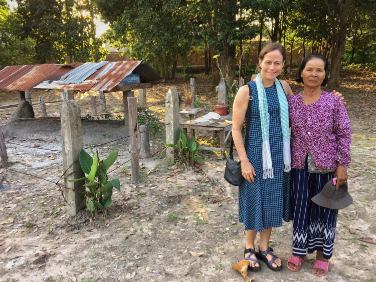 At Pol Pot's cremation site in Anlong Veng with caretaker Mrs Khomsim Sim.