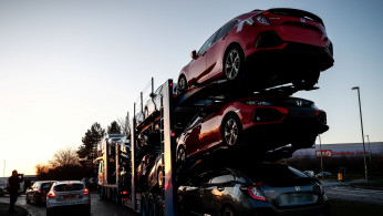 A lorry with car carrier trailer leaves the Honda car plant in Swindon