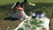 She lost her fiancé to gun violence. The day after she was set to be married, she visited his grave in her wedding dress.