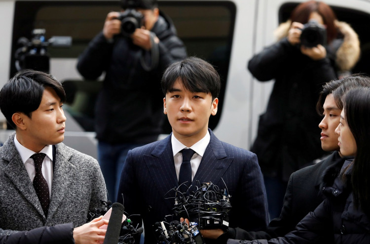 Seungri, a member of South Korean K-pop band Big Bang, arrives to be questioned over a sex bribery case at the Seoul Metropolitan Police Agency in Seoul.