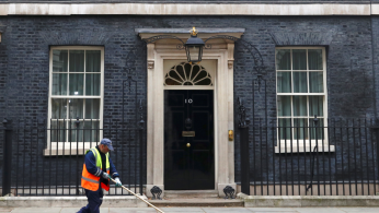 A road sweeper cleans up outside Number 10 Downing Street in London