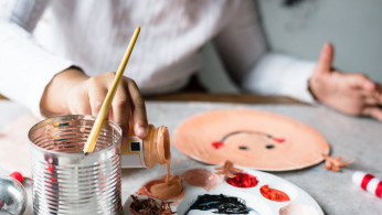 Woman Pouring Down a Brown Paint