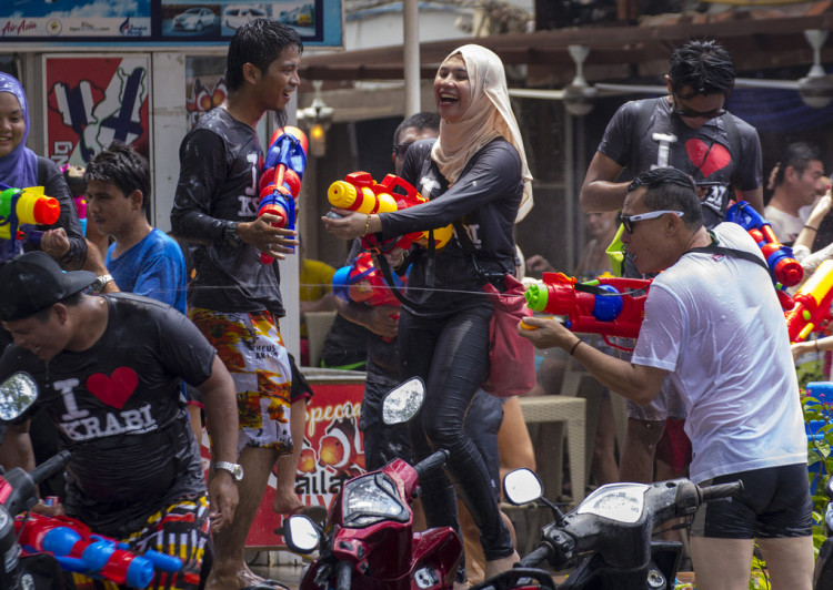 In Thailand, Cambodia, Myanmar, and Laos, people enjoy the festivity with water fights. 