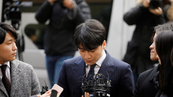 Seungri, a member of South Korean K-pop band Big Bang, arrives to be questioned over a sex bribery case at the Seoul Metropolitan Police Agency in Seoul, South Korea, March 14, 2019. 