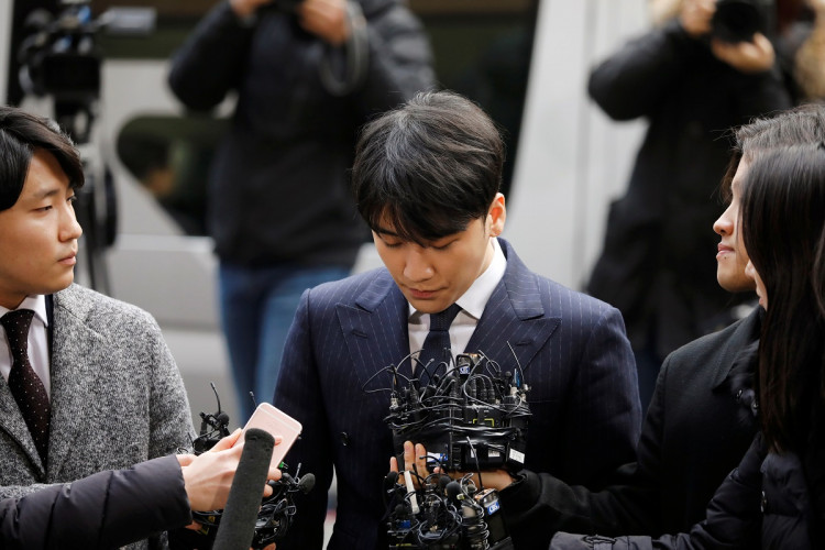 Seungri, a member of South Korean K-pop band Big Bang, arrives to be questioned over a sex bribery case at the Seoul Metropolitan Police Agency in Seoul, South Korea, March 14, 2019. 