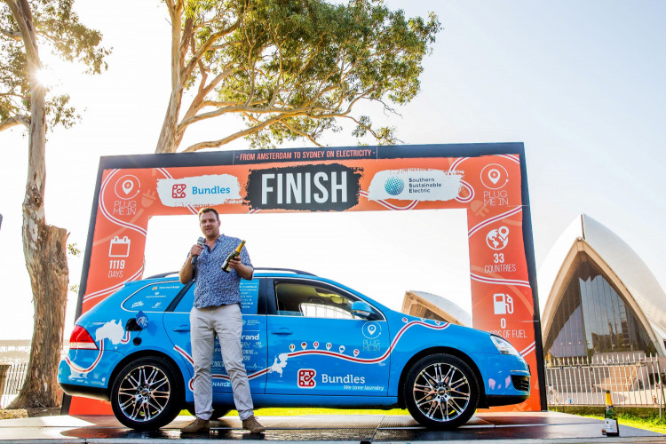 Dutch adventurer Wiebe Wakker finishes his three-year electric car journey from the Netherlands to Australia, in Sydney