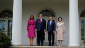 Melania Trump Strikes A Pose In $4750 Wrap With POTUS and South Korean Leader Post Copycat Wedding Accusation