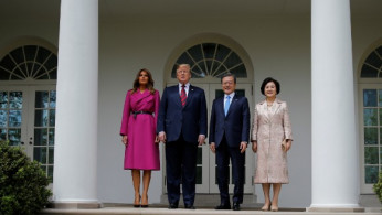 Melania Trump Strikes A Pose In $4750 Wrap With POTUS and South Korean Leader Post Copycat Wedding Accusation