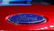 The logo is seen on the bonnet of a new Ford Aspire car during its launch in New Delhi