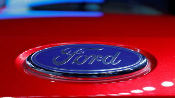 The logo is seen on the bonnet of a new Ford Aspire car during its launch in New Delhi
