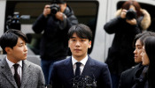 FILE PHOTO: Seungri, a member of South Korean K-pop band Big Bang, arrives to be questioned over a sex bribery case at the Seoul Metropolitan Police Agency in Seoul, South Korea, March 14, 2019.