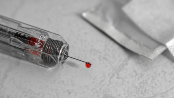 White and clear glass syringe
