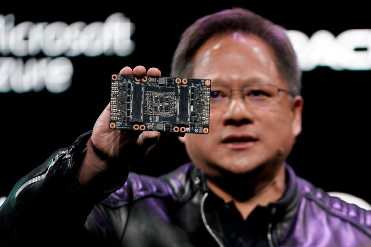 Jensen Huang, CEO of Nvidia, shows the NVIDIA Volta GPU computing platform at his keynote address at CES in Las Vegas