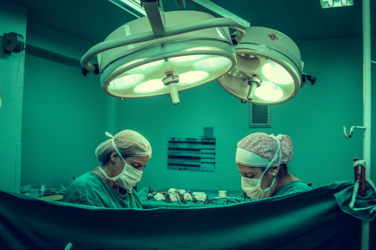 Two person doing surgery