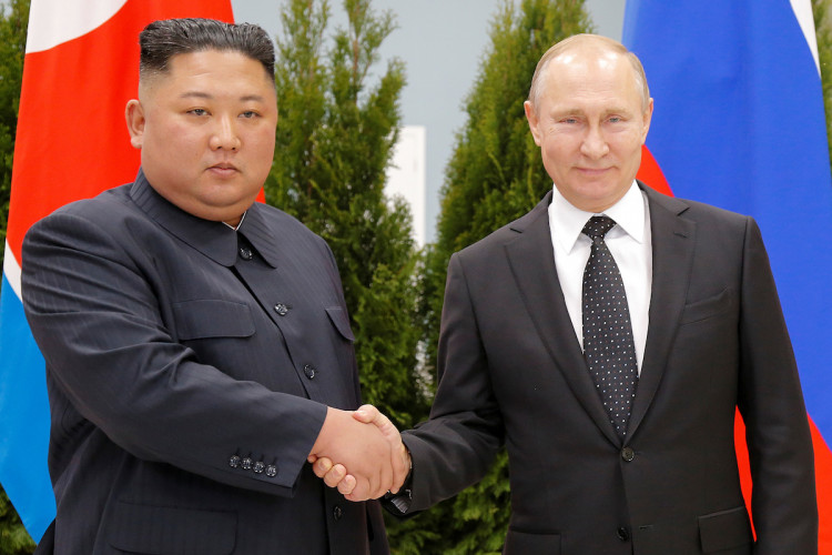 North Korean leader Kim Jong Un shakes hands with Russian President Vladimir Putin in Vladivostok