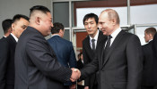 Russian President Vladimir Putin shakes hands with North Korea's leader Kim Jong Un following their talks in Vladivostok