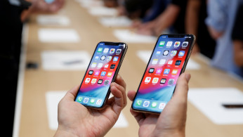 A demonstration of the newly released Apple products is seen following the product launch event in Cupertino