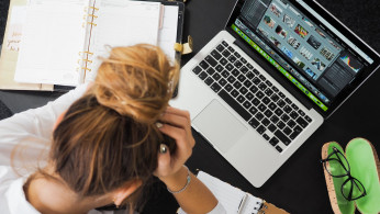 stressed woman in front of her computer