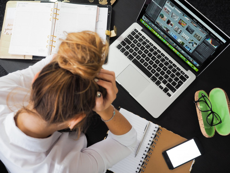 stressed woman in front of her computer