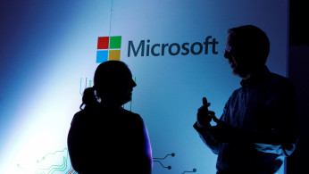 Microsoft Corporate Vice President Michael Fortin talks to a delegate at the opening of the Microsoft Corp; Africa development centre (ADC) in Nairobi