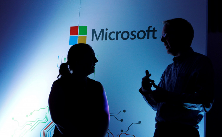 Microsoft Corporate Vice President Michael Fortin talks to a delegate at the opening of the Microsoft Corp; Africa development centre (ADC) in Nairobi