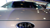 The logo of Kia Motors is pictured on a car at Kia Motors