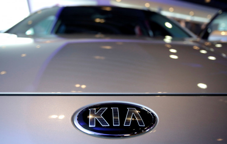 The logo of Kia Motors is pictured on a car at Kia Motors