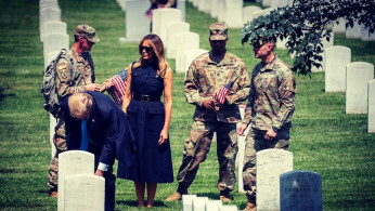 Melania And Donald Trump Pay Early Respects At Arlington National Cemetery