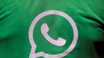  A logo of WhatsApp is pictured on a T-shirt