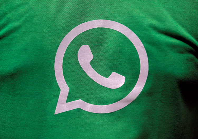  A logo of WhatsApp is pictured on a T-shirt