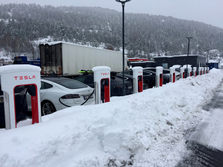 Electric cars are seen at Tesla charging station