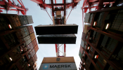 Containers are seen being unloaded from Maersk's Triple-E giant container ship Maersk Majestic, one of the world's largest container ships, at the Yangshan Deep Water Port