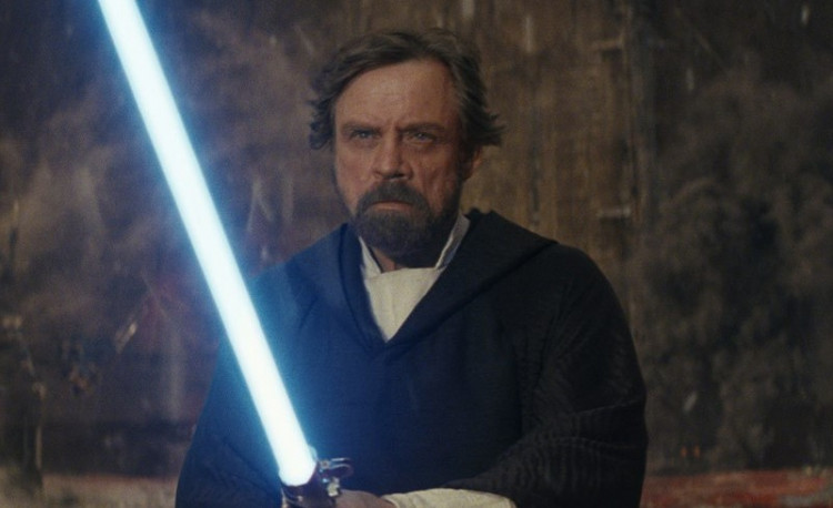 Luke Skywalker (Mark Hamill) with his lightsaber in 'Star Wars: The Last Jedi'